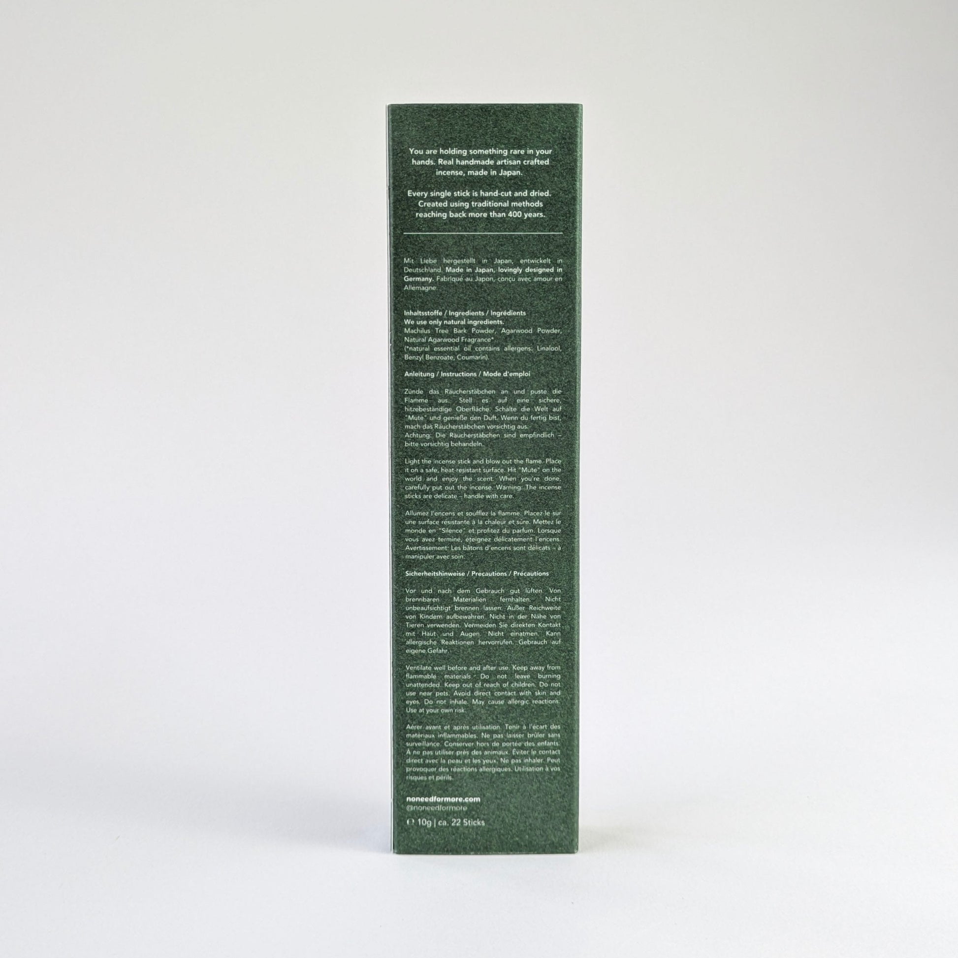 green incense box with text on a white background agarwood